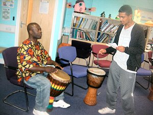 A young person displays his creative writing through Rhythm And Poetry (RAP)